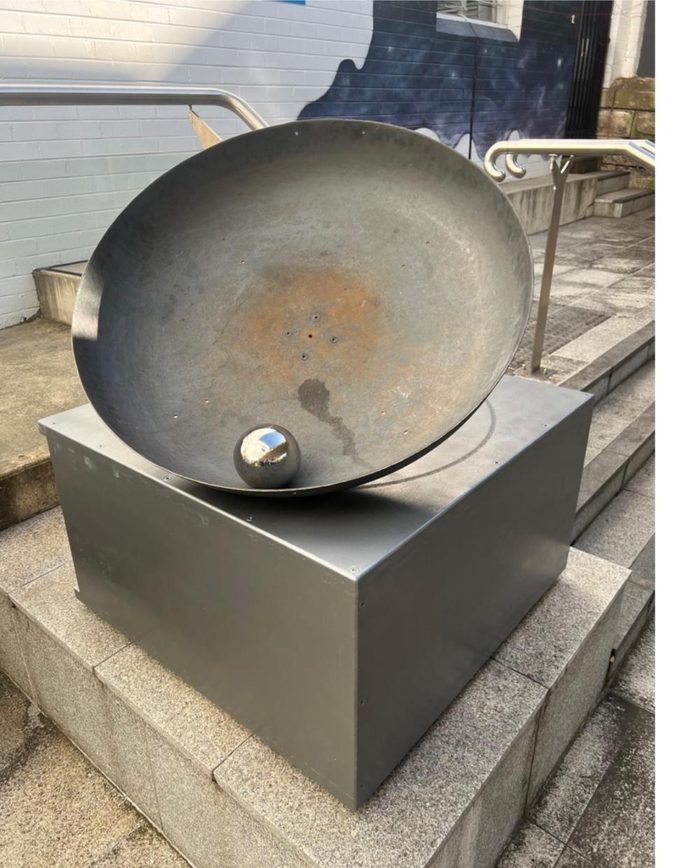 Edge of Bliss, Ball and Bowl, steel sculpture on a plinth