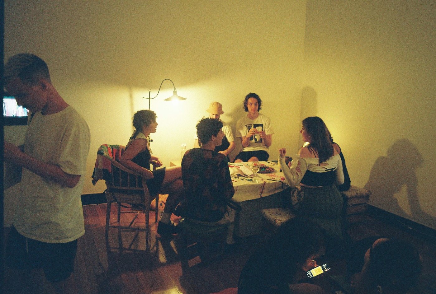Visitors gathered around the map table under a lamp
